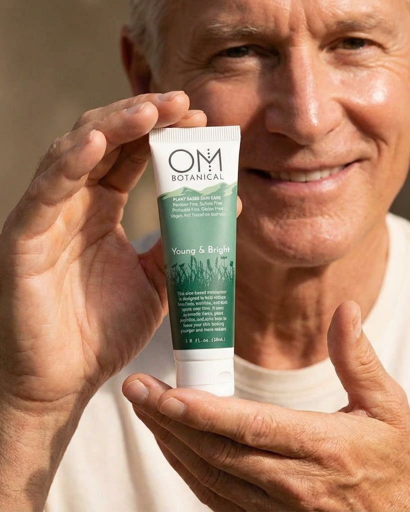 Man holding a tube of OM Botanical skincare product