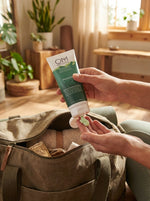 Person dispensing OM Botanical cream 