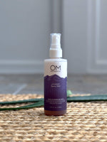 Antioxidant Spray Mist Toner - Lifestyle on a straw mat with aloe | OM Botanical