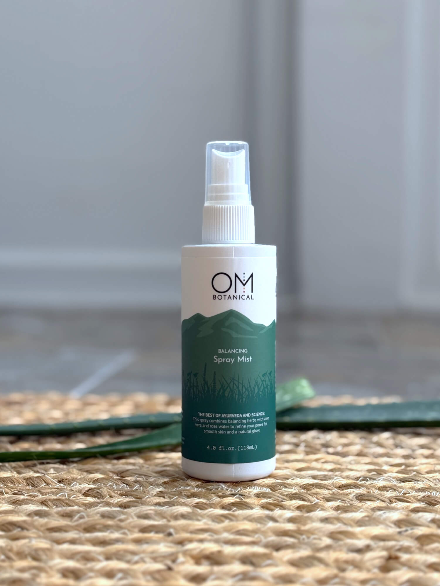 Balancing Spray Mist Toner - Lifestyle on a straw mat with aloe | OM Botanical