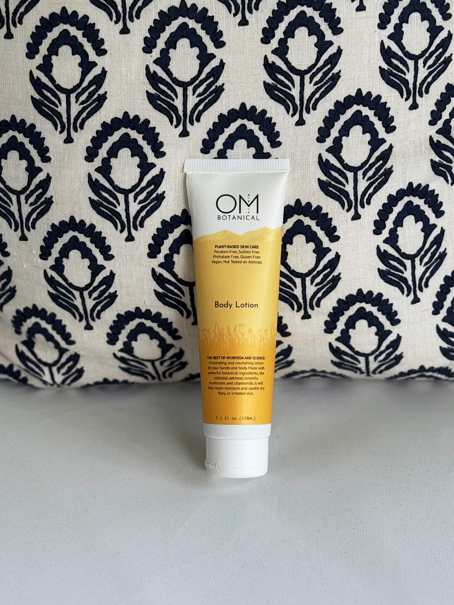 Body Lotion - lifestyle on a couch scene | OM Botanical