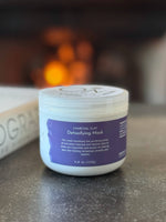 Charcoal Clay Mask - lifestyle on table by fireplace | OM Botanical