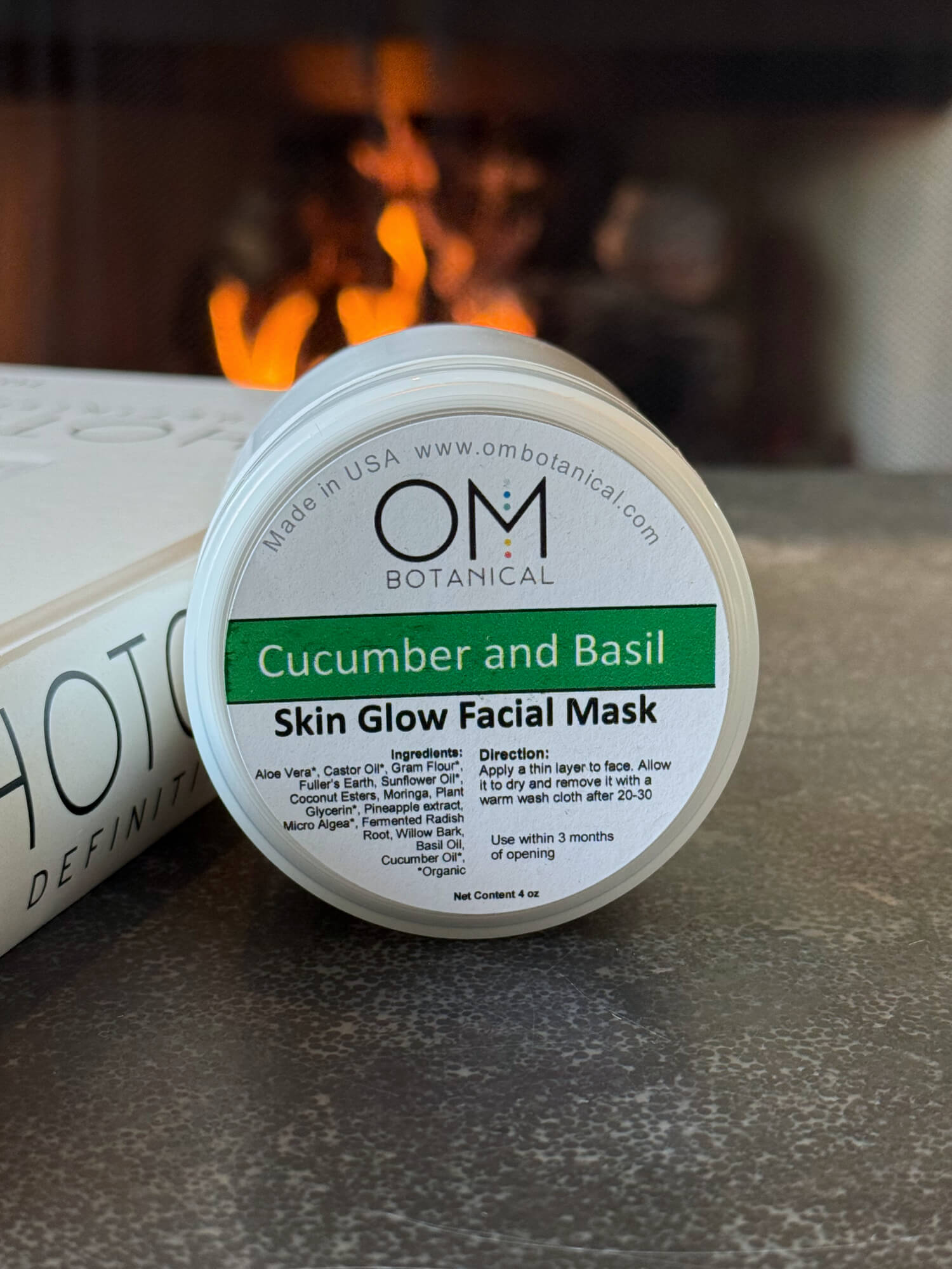 Cucumber Basil Mask - lifestyle on table by fireplace | OM Botanical