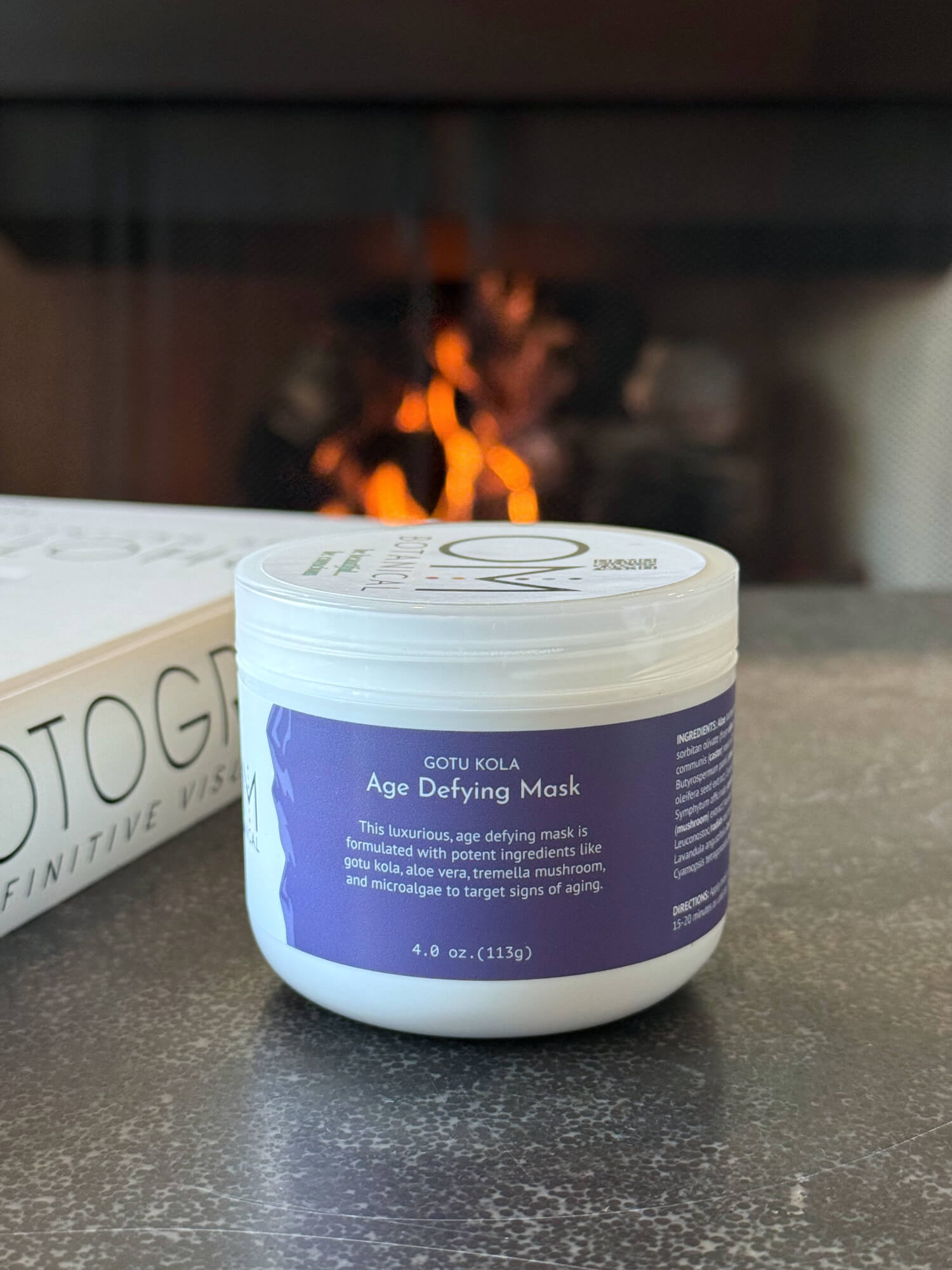 Gotu Kola Mask - lifestyle on table by fireplace | OM Botanical