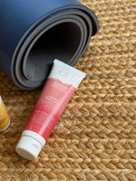 Magnesium Body Lotion - lifestyle next to yoga mat to soothe sore muscles | OM Botanical