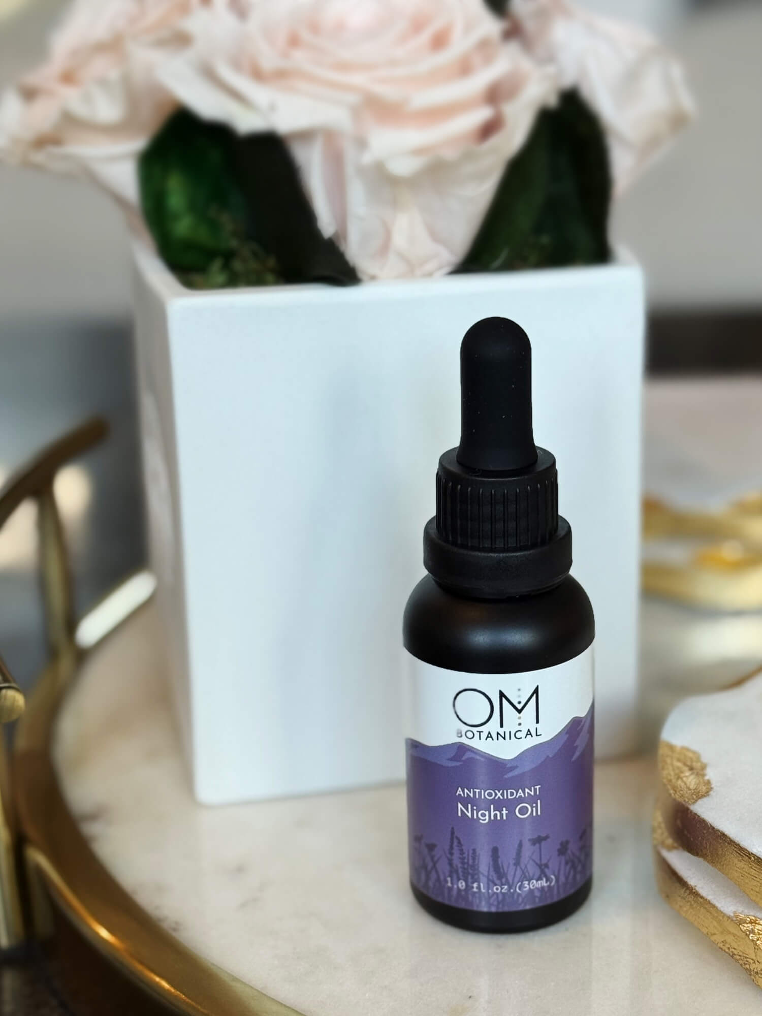 Antioxidant Night Oil - lifestyle on tray during evening beauty ritual | OM Botanical