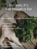 Fresh herbs and linen cloth with text highlighting clean, plant-based skincare ingredients