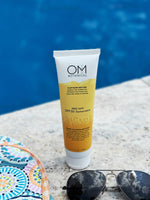 Reef safe spf30 sunscreen - lifestyle in the sun next to pool | OM Botanical