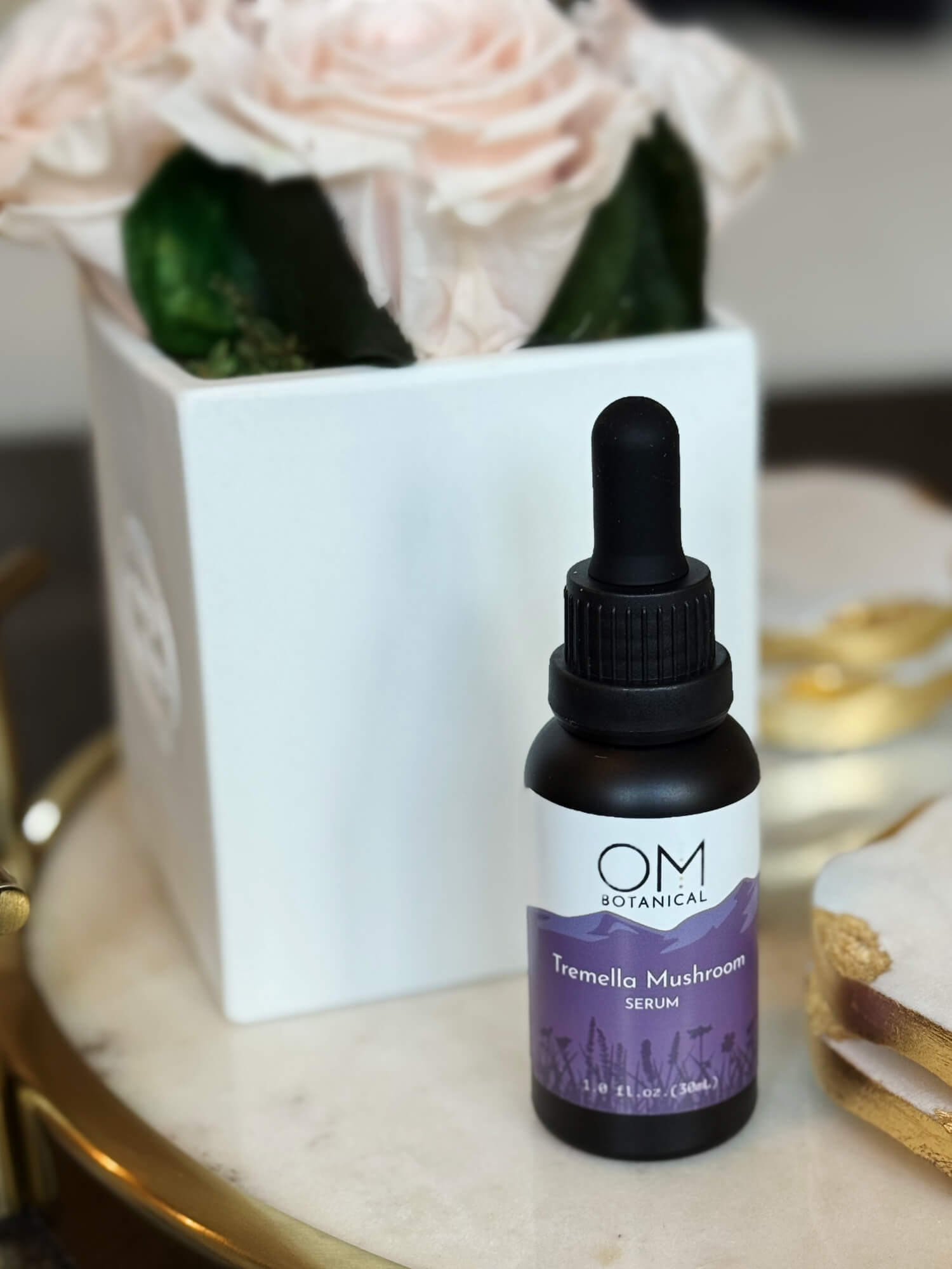 Tremella Mushroom Serum - lifestyle on tray during evening beauty ritual | OM Botanical